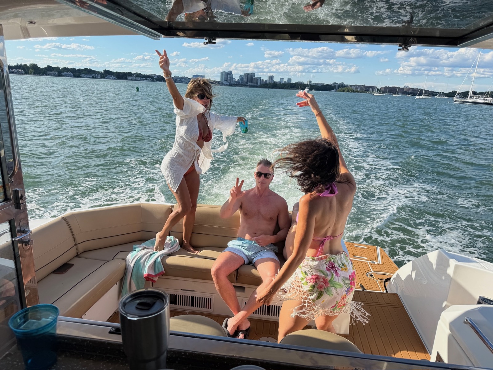 Guests enjoying a private party on the deck of a charter yacht